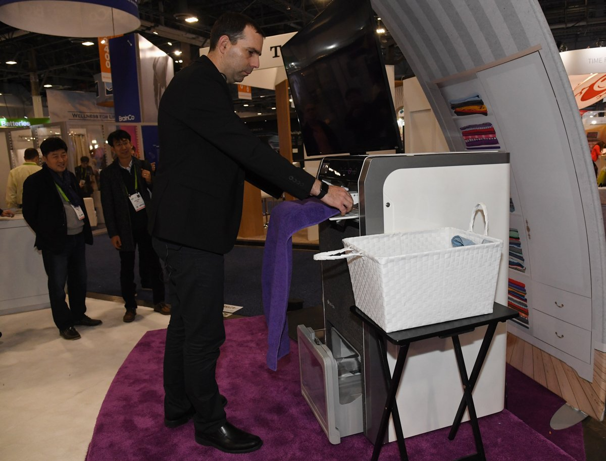 FoldiMate founder and CEO Gal Rozov demonstrates the FoldiMate — a robotic laundry folder that can fold a load of laundry in under four minutes.