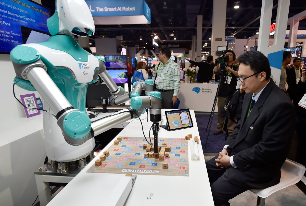 An intelligent vision robot plays a game of Scrabble at the Industrial Technology Research Institute booth.